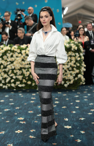 Anne Hathaway poses during the Met Gala, an annual fundraising gala held for the benefit of the Metropolitan Museum of Art's Costume Institute with this year's theme 'Superfine: Tailoring Black Style,' in New York City, New York, U.S., May 5, 2025.,Image: 995498522, License: Rights-managed, Restrictions: , Model Release: no, Credit line: Mario Anzuoni / Reuters /